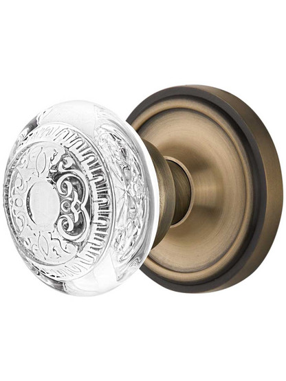 Classic Rosette Door Set with Egg and Dart Crystal-Glass Knobs in Antique Brass.